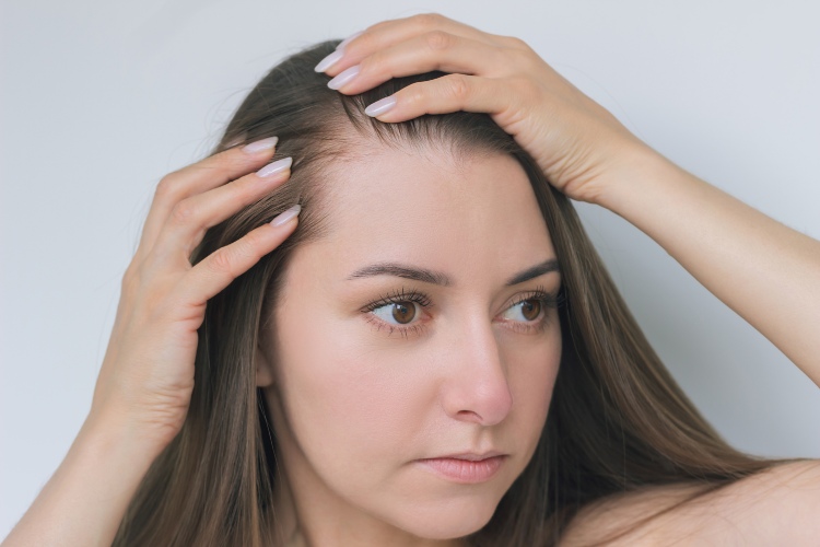 Man wearing a LaserCap® for advanced hair and skin treatments in the Greater Edmonton Area
